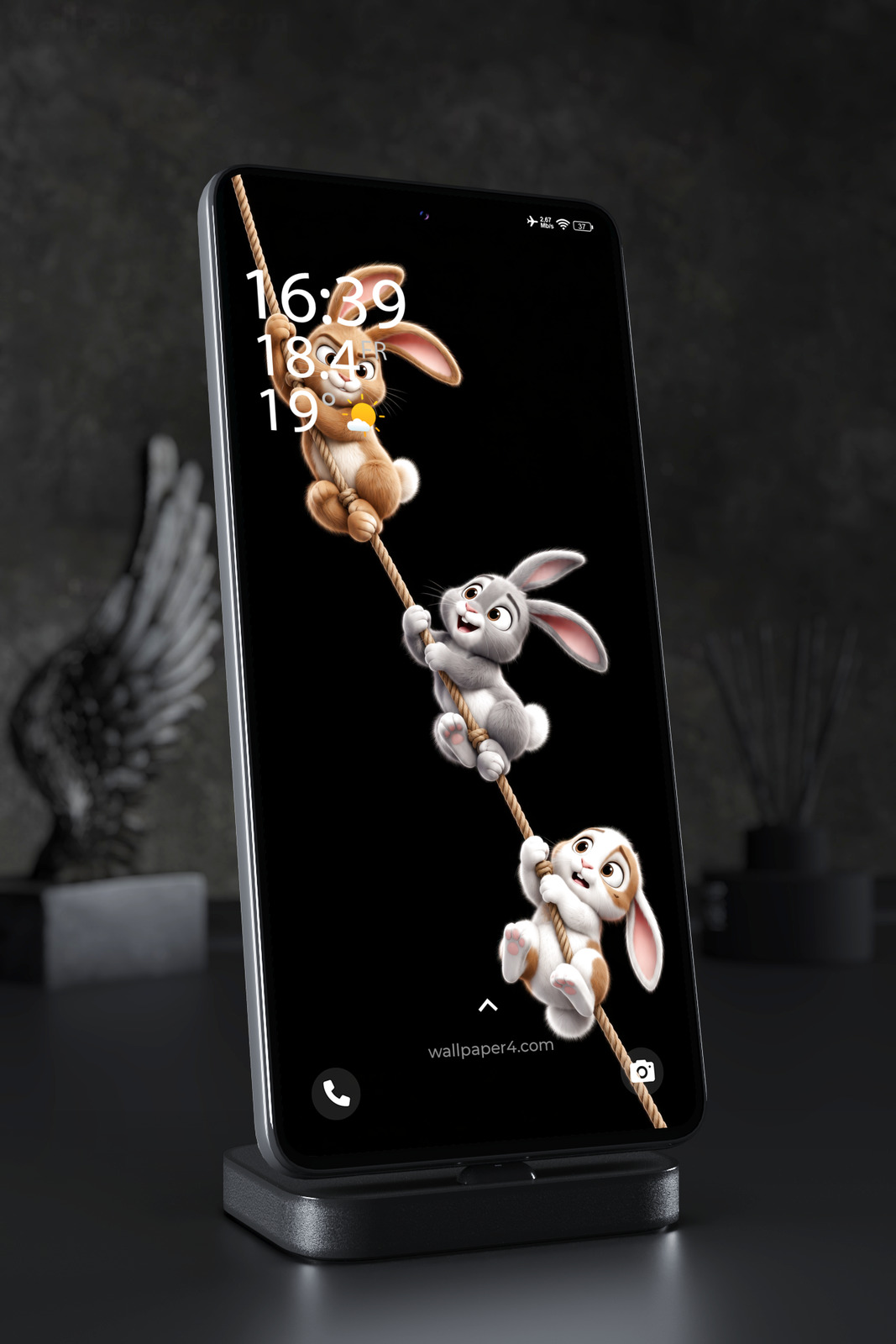Mobile Wallpaper 8849 - Three Playful Rabbits Climbing a Rope