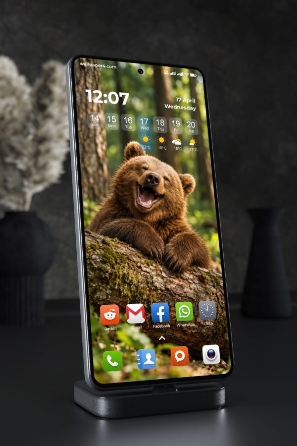 Phone Wallpaper 9210 - Laughing Brown Bear Cub Beside a Forest Tree