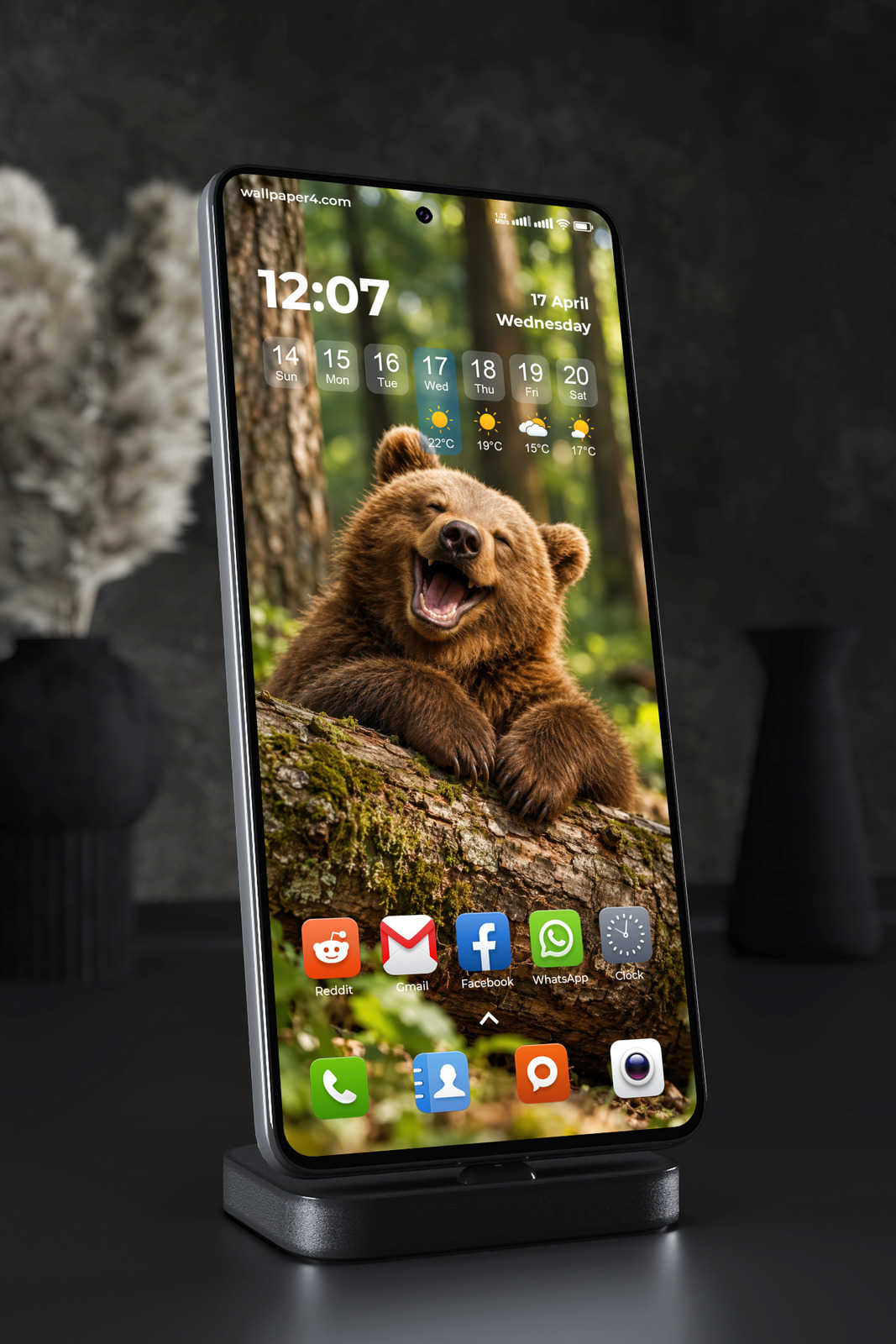 Phone Wallpaper 9210 - Laughing Brown Bear Cub Beside a Forest Tree